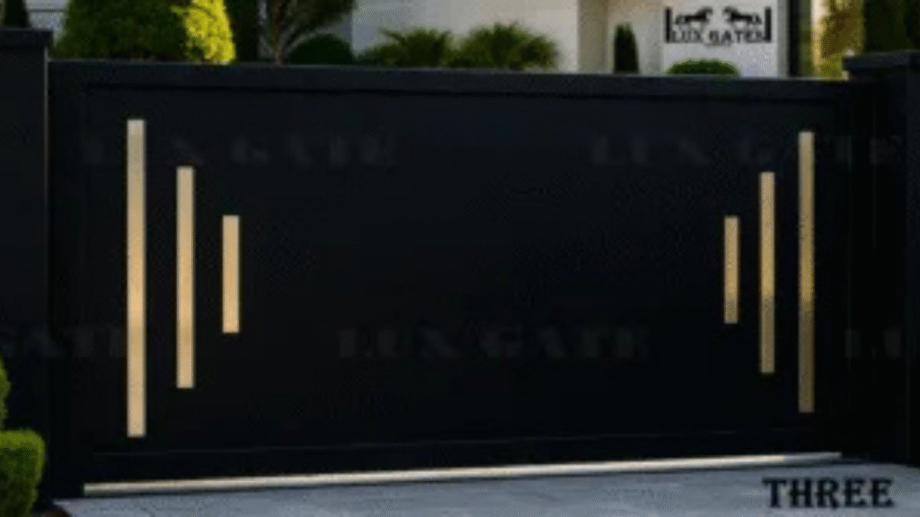 Black modern driveway gate with elegant gold vertical accents.